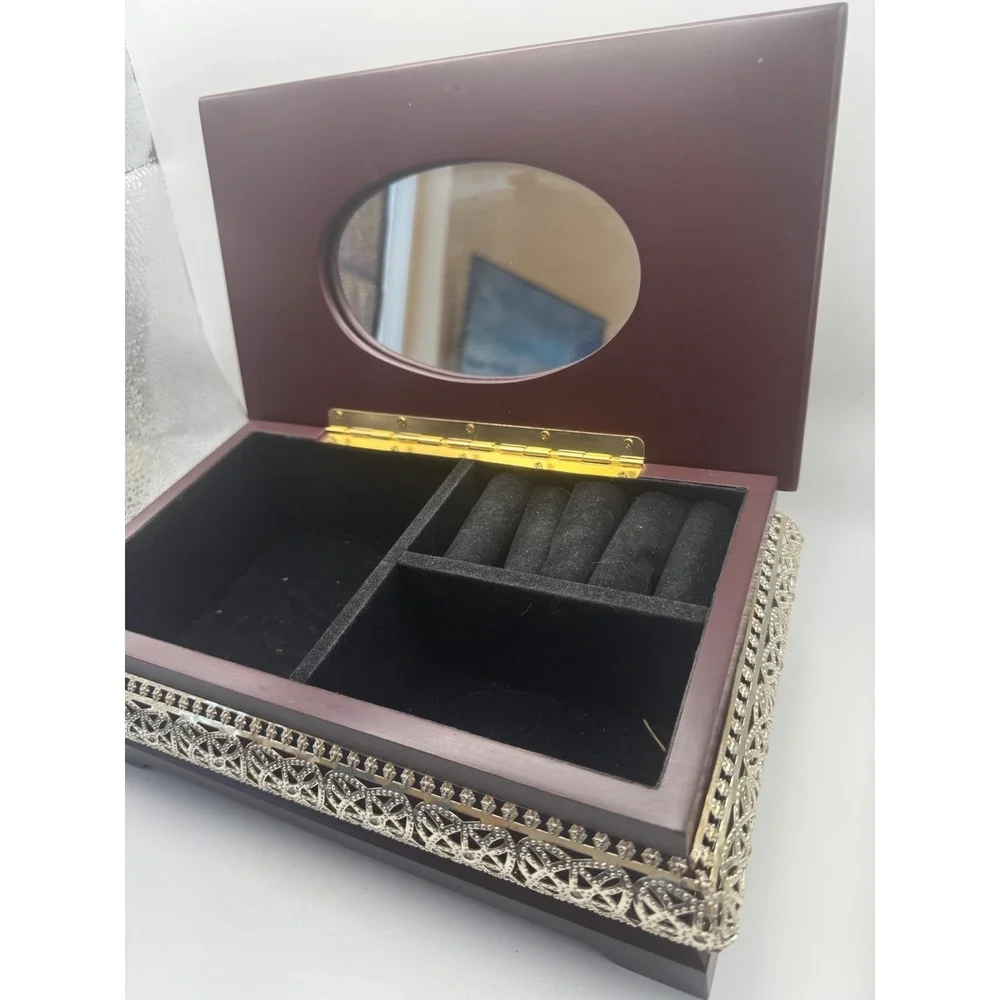 Elegant Wooden Jewelry Box with Ornate Metal Accents and Mirror